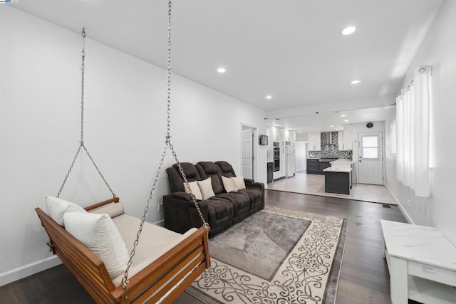 living room featuring dark wood-type flooring