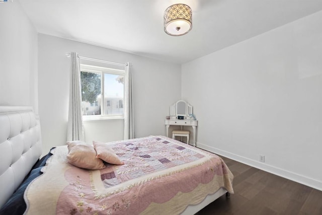 bedroom featuring dark wood-type flooring