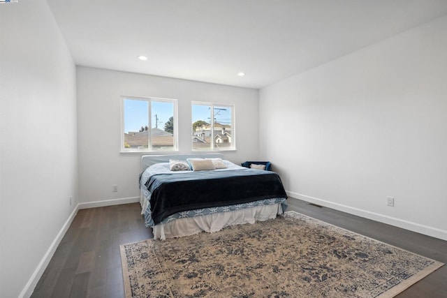 bedroom featuring dark wood-type flooring