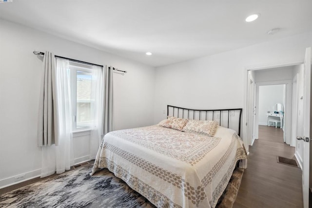 bedroom featuring dark hardwood / wood-style flooring