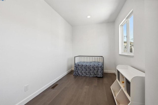 bedroom featuring dark hardwood / wood-style floors