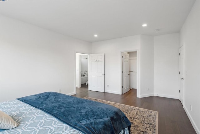 bedroom featuring dark hardwood / wood-style flooring