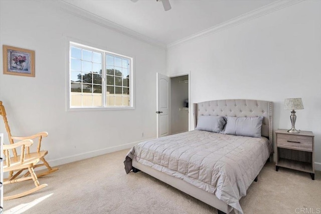 bedroom with ceiling fan, ornamental molding, and carpet