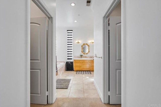 hallway featuring light tile patterned flooring