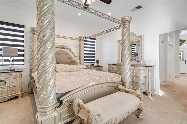 bedroom featuring ceiling fan, ornamental molding, and light carpet