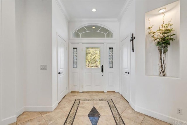 tiled foyer with ornamental molding