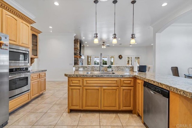 kitchen featuring pendant lighting, appliances with stainless steel finishes, crown molding, and light tile patterned floors