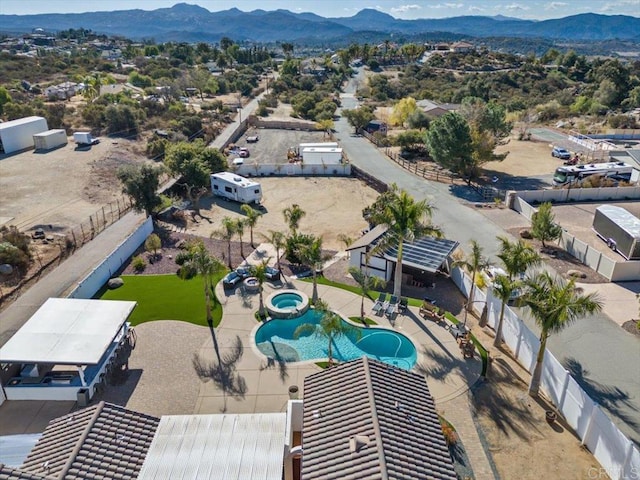 birds eye view of property featuring a mountain view