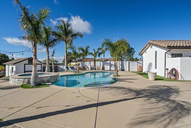 view of swimming pool with an in ground hot tub and a patio