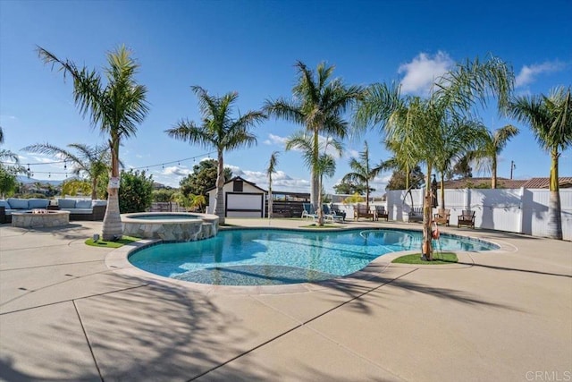 view of pool with an outdoor living space, a patio, and an in ground hot tub