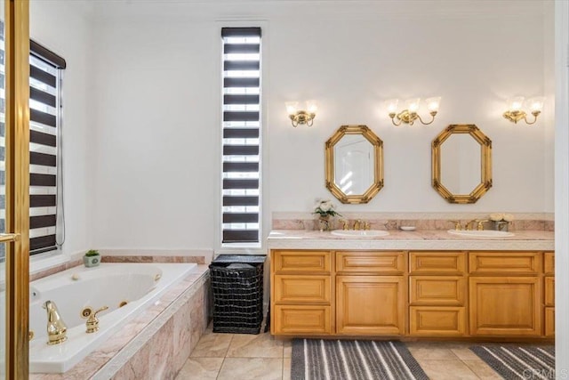 bathroom featuring a relaxing tiled tub, vanity, and tile patterned flooring