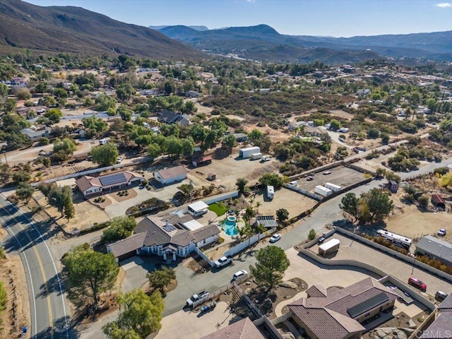 birds eye view of property featuring a mountain view