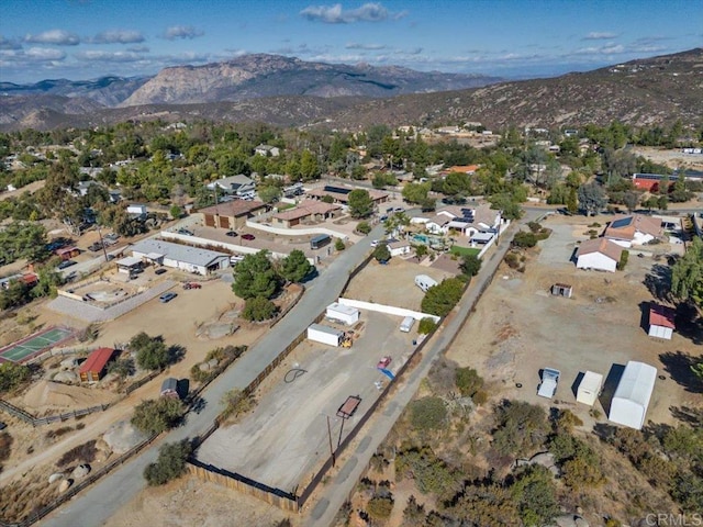 birds eye view of property featuring a mountain view