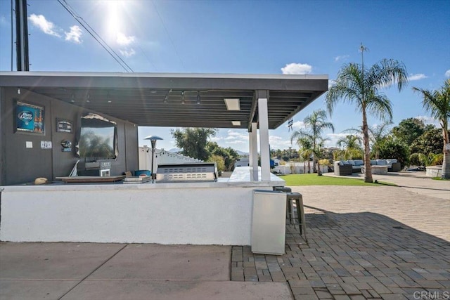 view of home's community with a bar, outdoor lounge area, and a patio