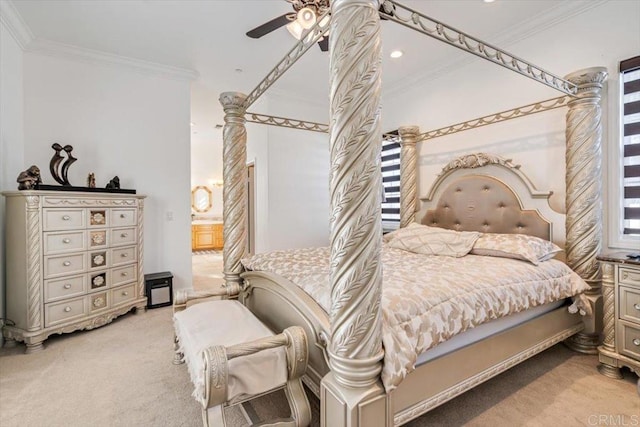 carpeted bedroom featuring crown molding and ceiling fan