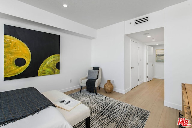 bedroom with light hardwood / wood-style flooring