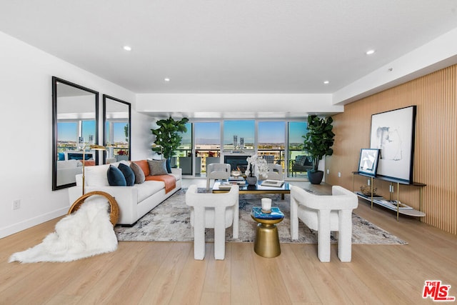 living room with a healthy amount of sunlight and light wood-type flooring