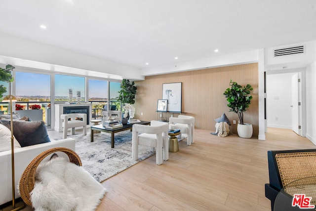 living room with light hardwood / wood-style flooring