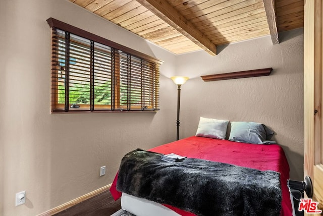 bedroom with wood-type flooring, wooden ceiling, and beamed ceiling