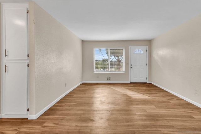 foyer with light hardwood / wood-style flooring