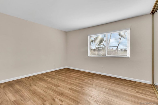 empty room with light wood-type flooring