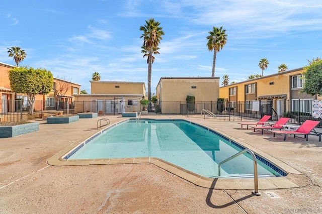 view of swimming pool with a patio area