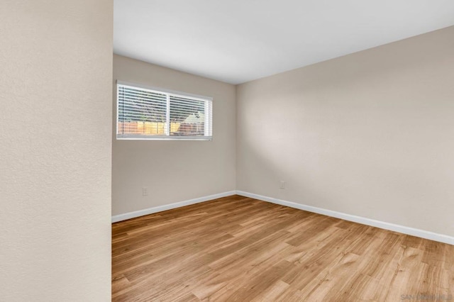 unfurnished room featuring light hardwood / wood-style floors