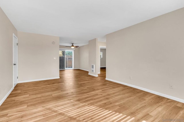 unfurnished room featuring ceiling fan and light wood-type flooring