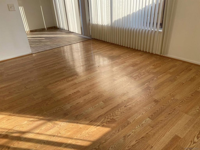 unfurnished room featuring light hardwood / wood-style floors