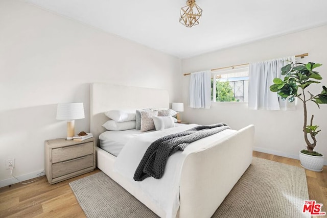 bedroom with light wood-type flooring