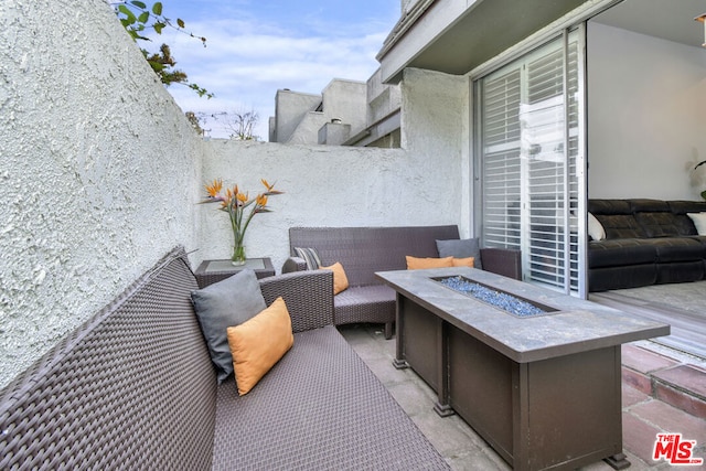 view of patio / terrace featuring a fire pit