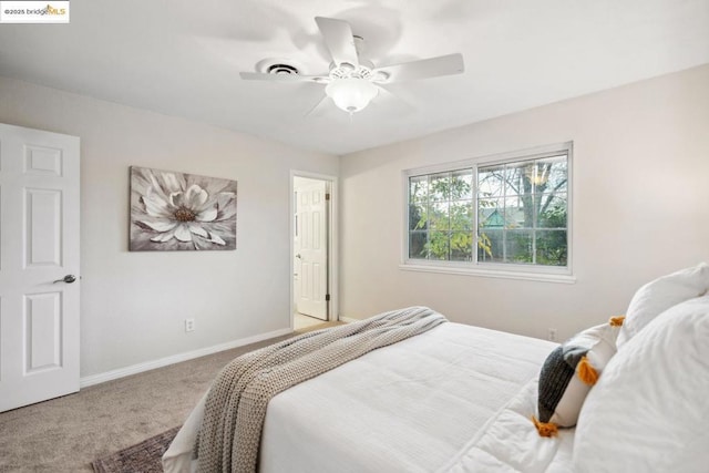 carpeted bedroom with ceiling fan