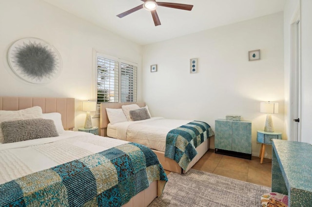 bedroom featuring light tile patterned flooring and ceiling fan