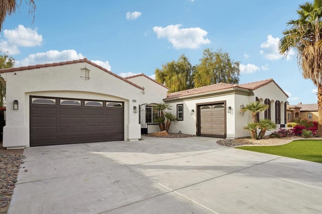 mediterranean / spanish house featuring a garage