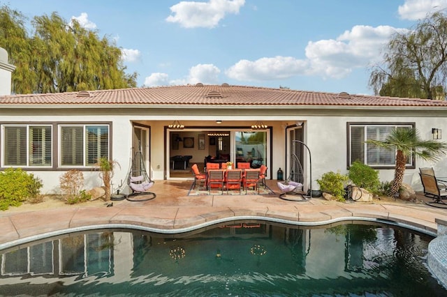 back of house with a patio