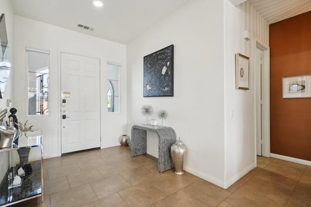 entrance foyer with light tile patterned floors