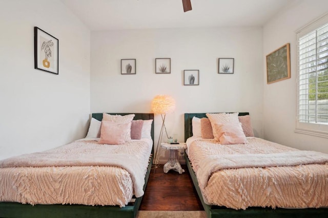 bedroom featuring dark hardwood / wood-style floors and ceiling fan