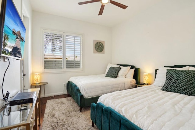 bedroom featuring wood-type flooring and ceiling fan