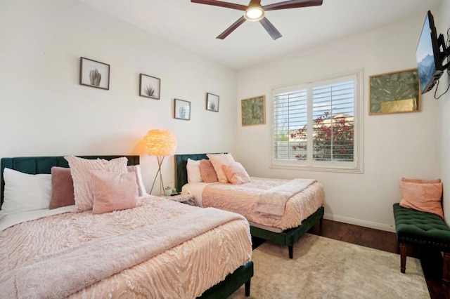 bedroom with hardwood / wood-style floors and ceiling fan