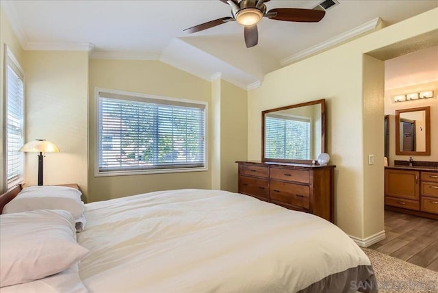 bedroom with hardwood / wood-style flooring, lofted ceiling, ceiling fan, and multiple windows