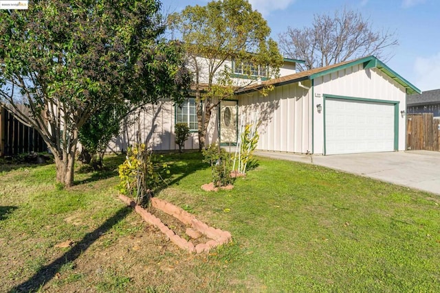 view of front of property featuring a garage and a front lawn