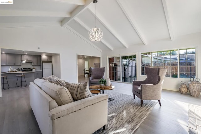 living room with hardwood / wood-style flooring, beamed ceiling, high vaulted ceiling, and a chandelier