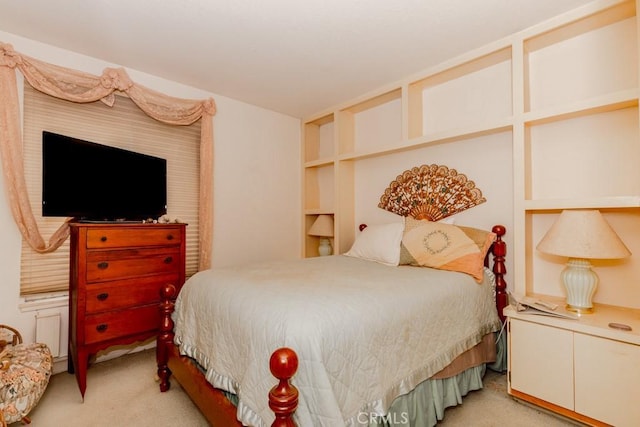 bedroom with light colored carpet