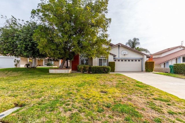 view of front of home featuring a garage and a front yard