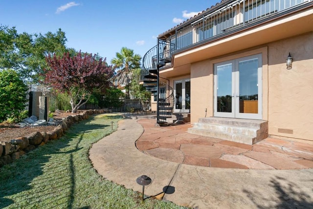 view of yard featuring a patio area and french doors