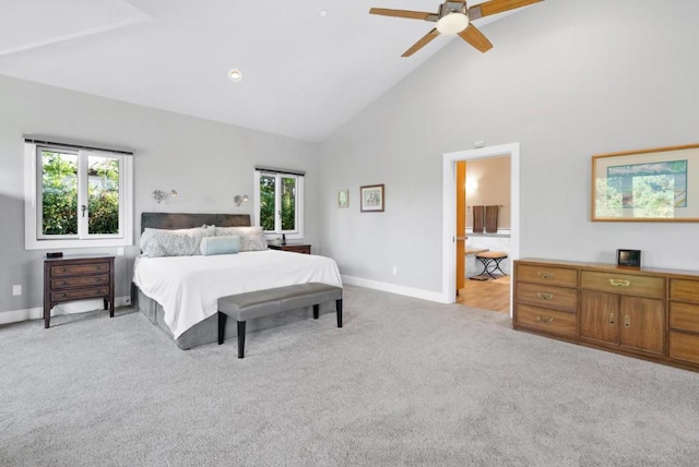 bedroom featuring ceiling fan, light carpet, and high vaulted ceiling