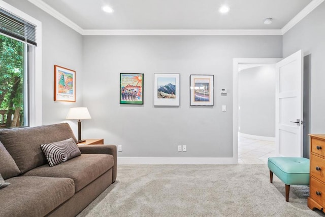 sitting room featuring ornamental molding and light colored carpet