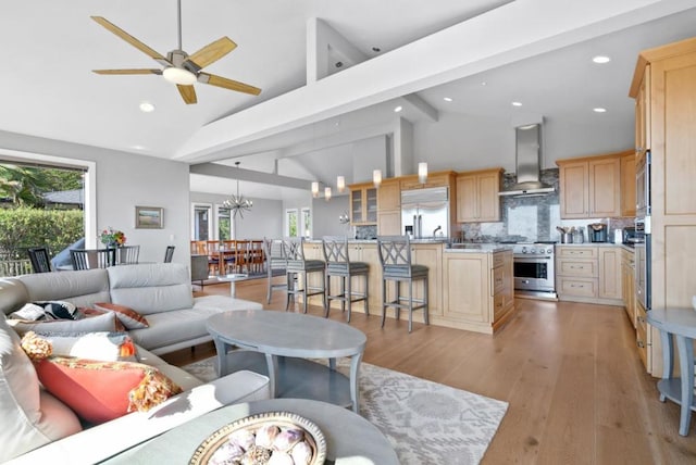 living room with beamed ceiling, high vaulted ceiling, ceiling fan with notable chandelier, and light wood-type flooring