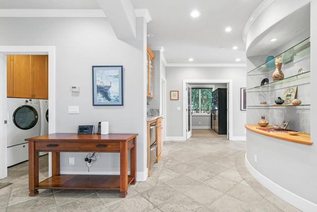 interior space with crown molding and separate washer and dryer