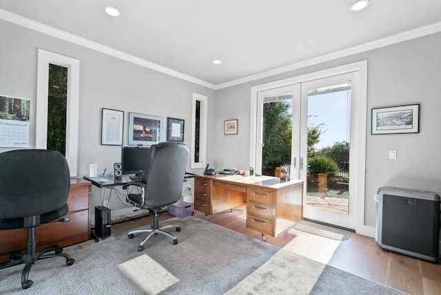 office space featuring french doors, ornamental molding, and light hardwood / wood-style floors